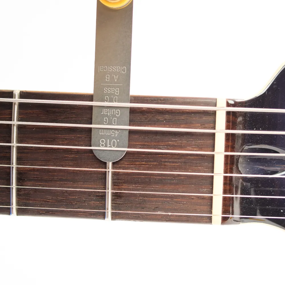 Works on Acoustic and Electric Guitars