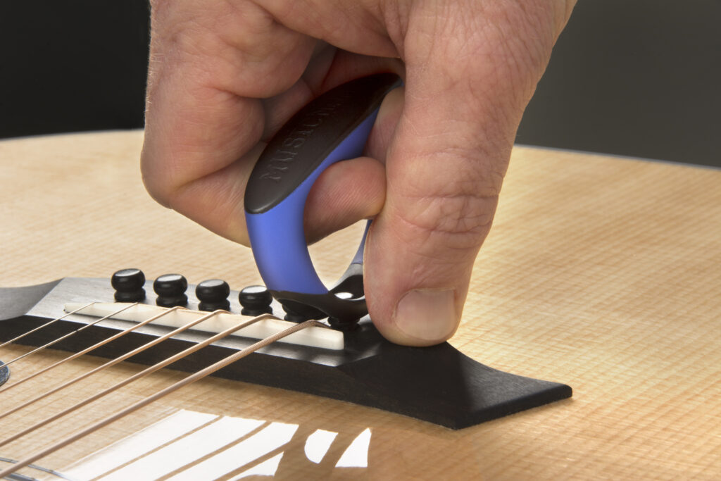 using MusicNomad GRIP Puller to safely remove acoustic guitar bridge pin